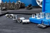 A set of socket wrenches and a car engine block on a dark surface. Náhled obrázku produktu