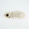 A top-down view of a single beige boot with fur lining on a white background. Produktbild-Vorschau