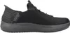 A side view of a black Skechers slip-on shoe. Voir les images du produit