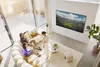 A family is watching TV in a modern living room. Produktbild-Vorschau