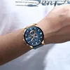 A man's arm wearing a watch. Produktbild-Vorschau