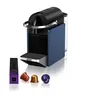 A Nespresso coffee machine with coffee capsules and packaging. Produktbild-Vorschau