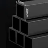 Close-up view of stacked black metal square tubes with dimensions indicated. Produktbild-Vorschau