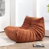 A brown beanbag chair is placed on a light-colored rug in a room with a window and blinds in the background. Náhľad obrázku produktu