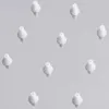 A pattern of small, white, nozzle-like objects against a light gray background. Produktbild-Vorschau