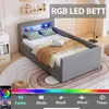 A child's bed with LED lighting and storage, set in a bedroom environment. Produktbild-Vorschau