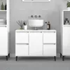 A clean, modern bathroom vanity with a sink and storage cabinets. Produktbild-Vorschau