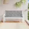 A white garden bench with a gray cushion on a wooden deck, with plants hanging in the background. Produktbild-Vorschau