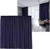 A collage showing a dark blue curtain in the foreground and a room interior with dark blue and white curtains, a desk, and a chair in the background. Produktbild-Vorschau