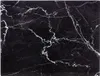 A close-up of a black marble cutting board with white veins. Náhľad obrázku produktu