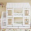 A white bunk bed with a house-like roof design, stairs with drawers, and small window cutouts, set against a plain wall. Náhľad obrázku produktu