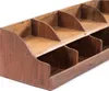 A close-up, angled view of a wooden organizer with multiple compartments. Náhled obrázku produktu