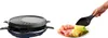 A raclette grill and a plate of food being served. Produktbild-Vorschau