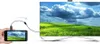 A hand holds a smartphone connected by a cable to a large TV screen displaying a landscape. Produktbild-Vorschau