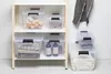 Storage boxes on a shelf and next to it. Produktbild-Vorschau