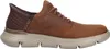 A side view of a brown Skechers slip-in sneaker. Náhled obrázku produktu