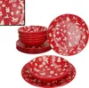A set of red Christmas-themed dinnerware, including plates and bowls, is displayed against a white background. Produktbild-Vorschau