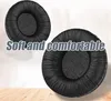 Two black ear pads for headphones are shown on a light background with a wooden floor in the foreground. Text overlay highlights their softness and comfort. Produktbild-Vorschau
