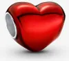 A close-up studio shot of a red heart-shaped charm with a silver opening. Produktbild-Vorschau