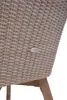 Close-up of the woven back of a chair with a small metal tag attached. Produktbild-Vorschau
