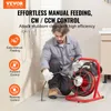 A man is using a pipe cleaning machine in a bathroom. Podgląd zdjęcia produktu