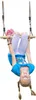 A young girl is hanging upside down from a wooden trapeze swing. Anteprima dell’immagine prodotto
