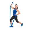 A woman is performing a lunge exercise with a blue resistance band. Produktbild-Vorschau
