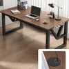 A modern desk in a home office setting, with a laptop, books, and a lamp. Podgląd zdjęcia produktu