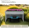 A wooden garage for a robotic lawnmower, with flowers planted on top, set in a garden. Náhled obrázku produktu
