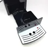 A close-up view of the drip tray and internal components of a coffee machine. Produktbild-Vorschau