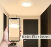 A hand holding a smartphone displaying a ceiling light, with a real ceiling light visible above. Anteprima dell’immagine prodotto