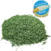 A pile of coated grass seeds on a white background with a marketing graphic in the upper right corner. Náhľad obrázku produktu