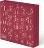 A close-up, angled view of a Christmas advent calendar with numbered doors and festive decorations. Anteprima dell’immagine prodotto