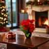 A festive living room scene with a Christmas tree, fireplace, and a table with a gift and poinsettias. Voir les images du produit