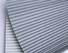 A close-up view of a light gray pleated fabric, likely a blind or curtain. Anteprima dell’immagine prodotto
