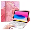 A tablet with a keyboard case and stylus, with a marble pattern on the case. Produktbild-Vorschau