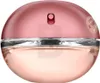 A close-up shot of a round, pink perfume bottle. Náhled obrázku produktu