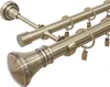 A close-up view of a double curtain rod with decorative finials and clip rings, set against a white background. Produktbild-Vorschau