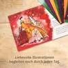 An open advent calendar with illustrations and text, lying on a wooden surface. Produktbild-Vorschau