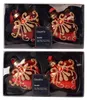 Weihnachtsherzen aus Glas in Rot mit goldenen Ornamenten und dekorativen Schmuckdetails im 2er Set Produktbild-Vorschau