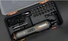 A black and gray case containing a cordless electric screwdriver and various bits, with a USB charging cable. Produktbild-Vorschau