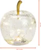 A decorative glass apple with LED lights inside, shown on a white background with dimensions indicated. Voir les images du produit