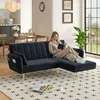 A woman reads a book on a black sectional sofa with gold legs in a living room. Anteprima dell’immagine prodotto