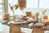 A dining table set for a meal with decorative elements. Náhled obrázku produktu