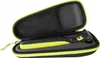 A black and green electric shaver is placed inside its open travel case. Produktbild-Vorschau