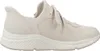 A side view of a beige sneaker. Produktbild-Vorschau