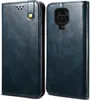 A product shot of a blue leather flip wallet case for a phone, shown from two angles. Produktbild-Vorschau