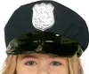 A close-up of a child wearing a police hat. Náhľad obrázku produktu
