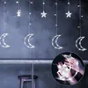 A string of moon and star-shaped LED lights hanging against a dark background, with a close-up inset showing hands holding some of the lights. Náhľad obrázku produktu