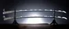 Two swords are displayed on a stand against a dark, spotlighted background. Podgląd zdjęcia produktu